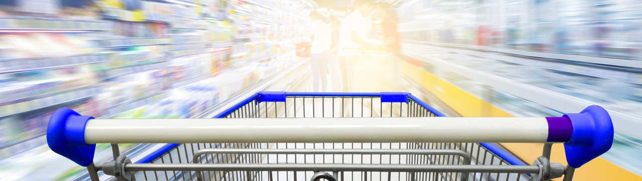 image of a shopping cart speeding through a grocery store aisle