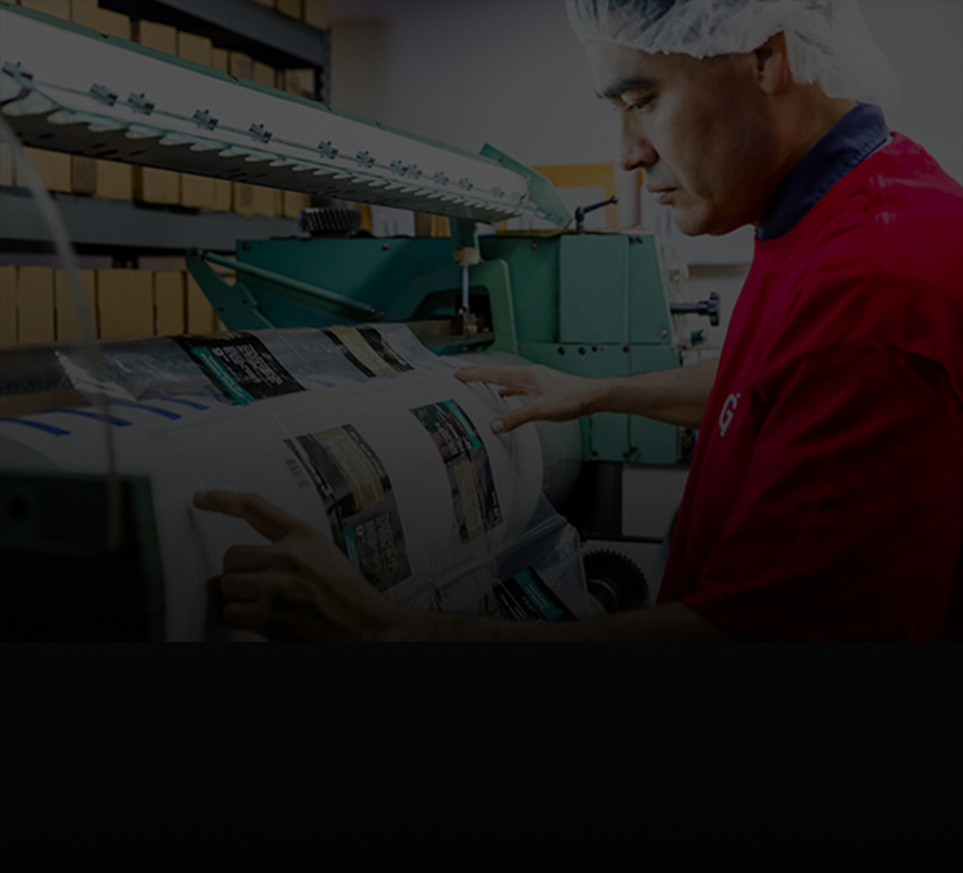 Great American Packaging worker operating printing equipment