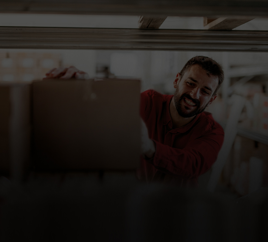 grocery store employee stocking shelves