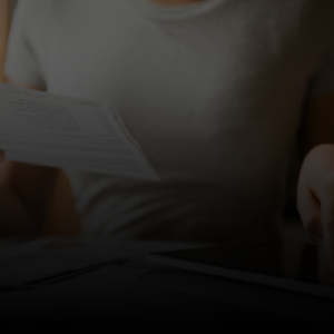 Image of a person reading a paper