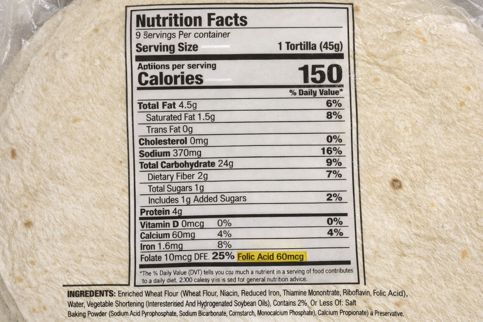 Photo of Tortilla bag with Nutrition Facts label including Folic Acid highlighted in the Ingredients list